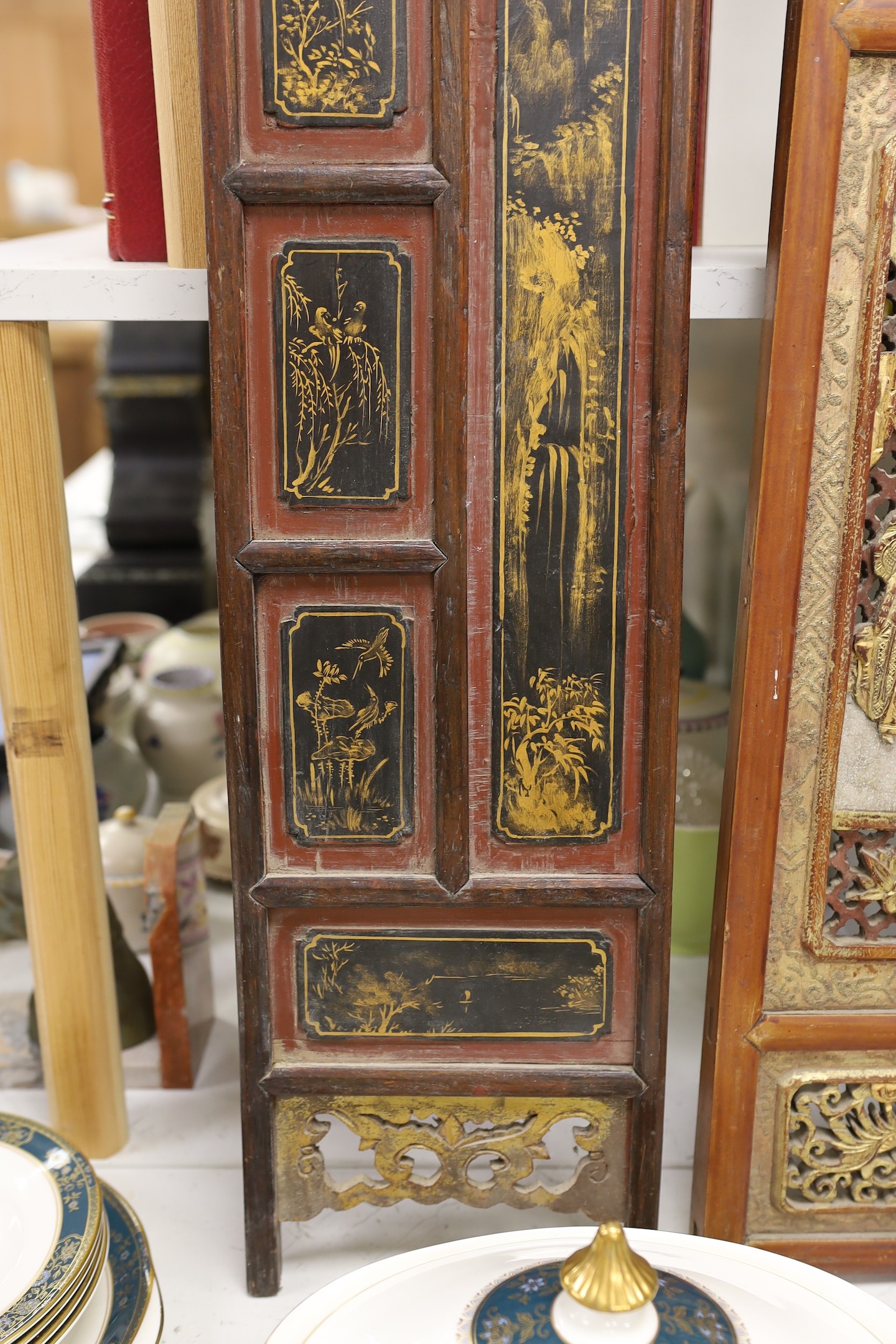 A pair of late 19th century Chinese gilt-decorated lacquer panels and a similar smaller rectangular pierced panel, tallest 91cms high